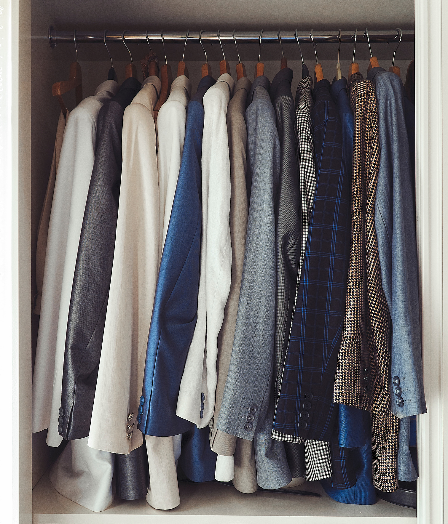 Gentleman closet men suits hanged and organized